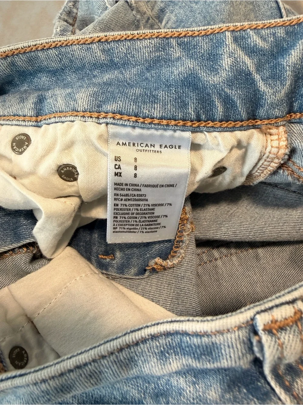 American Eagle Outfitters Women’s Light Blue Distressed Denim Midi Shorts